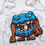 Grumpy Hunger Painz, Blue Donut Embroidery Patch